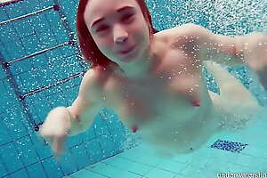 Cute hairy pussy teenie Nina upon the swimming pool