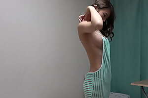 Defoliated slender girl wears revealing dress