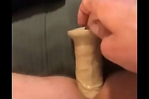 Jerking retire from in outfit with dildo