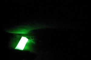 Chick fucks herself in the dark connected with a glowstick