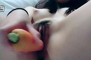 Asian teen masturbates to a carrot