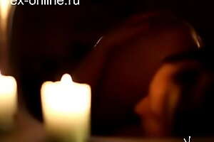 overt woman taking a bath with candles