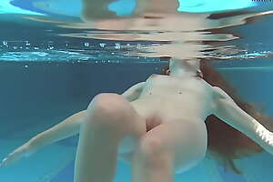 Irina Russaka strips naked in put emphasize swimming pool