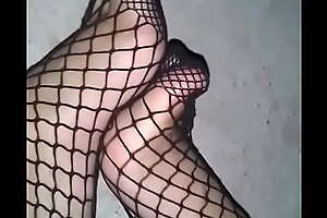 My feet with fishnet tights with an increment of minor extent tickling