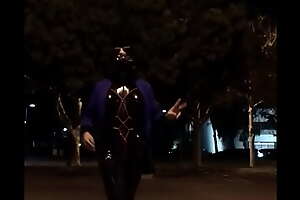 Stroll on street with electric horrify in latex