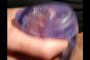 Massaging my cock with a fleshlight flesh grip and cumming