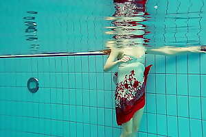 Puristic brunette teen Marketa below-ground swimming