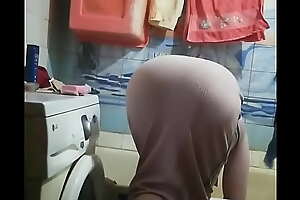 Maid washing clothes