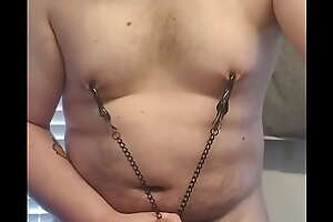 Fleshy rubbing his cock playing with nipple clamps